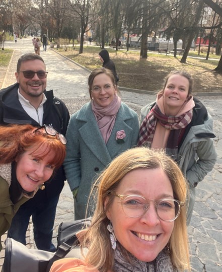 Ysi-Act project Laurea UAS team at the park. Group photo in a park landscape. Kaisa in front and Tepi, Niina, Laura and Anu in the back.